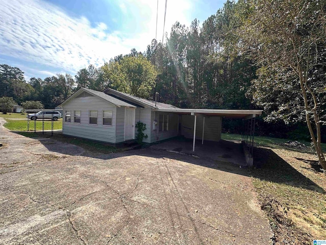 exterior space featuring a carport