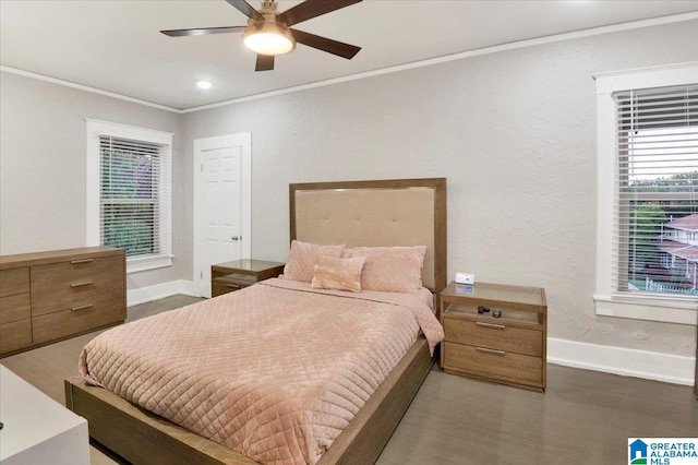 bedroom featuring ornamental molding, ceiling fan, and dark hardwood / wood-style flooring