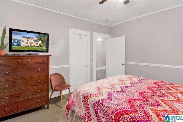 bedroom featuring ceiling fan and crown molding