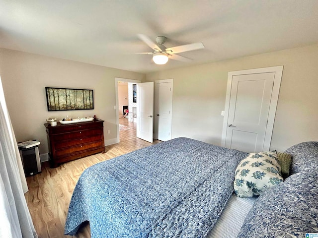 bedroom featuring ceiling fan and hardwood / wood-style flooring