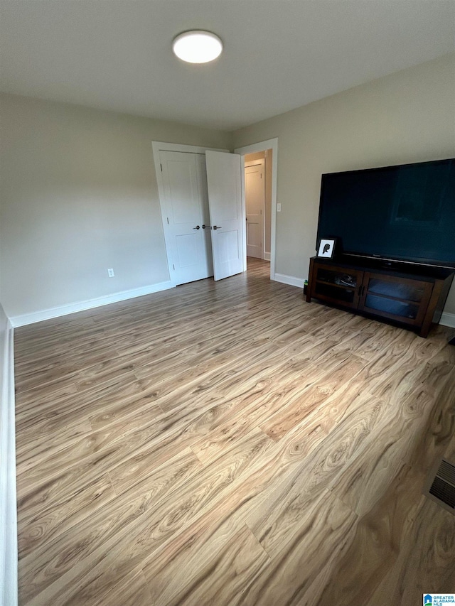 unfurnished living room featuring light hardwood / wood-style floors