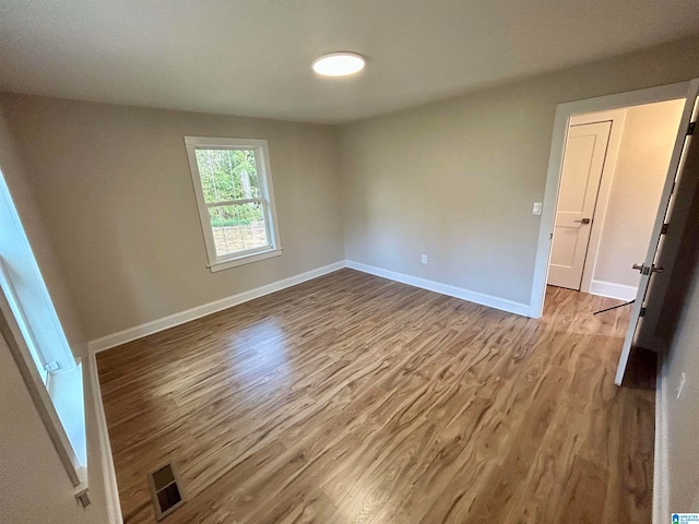 spare room featuring hardwood / wood-style floors