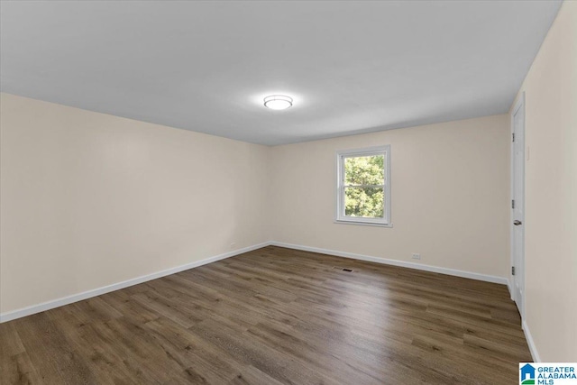 empty room featuring dark hardwood / wood-style floors