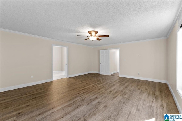 unfurnished room with ceiling fan, a textured ceiling, crown molding, and light hardwood / wood-style floors