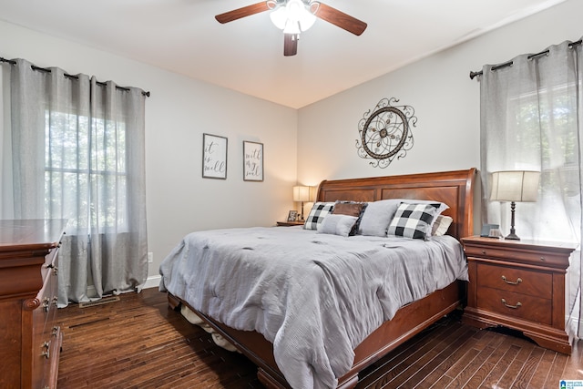 bedroom with dark wood-type flooring and ceiling fan