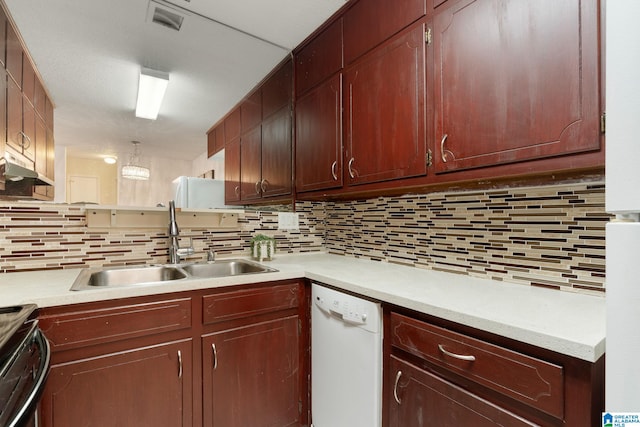 kitchen featuring hanging light fixtures, sink, stainless steel range with electric stovetop, backsplash, and dishwasher