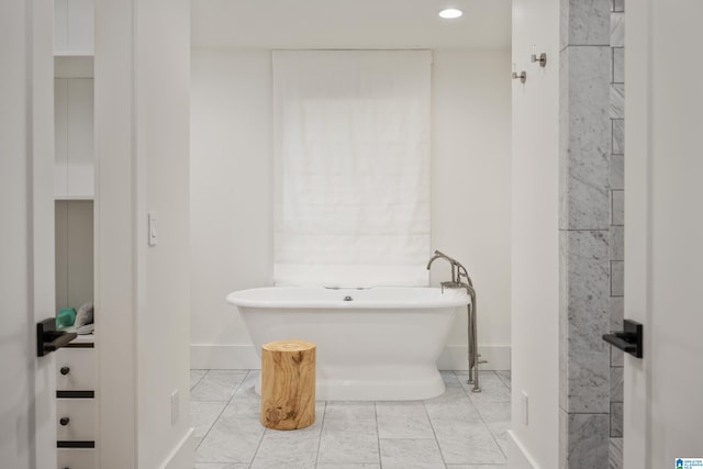 bathroom featuring a tub