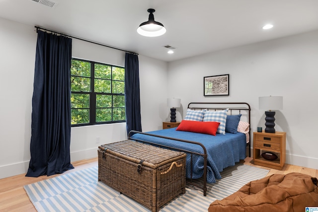 bedroom with wood-type flooring