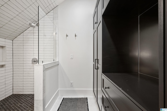 interior space featuring tiled shower