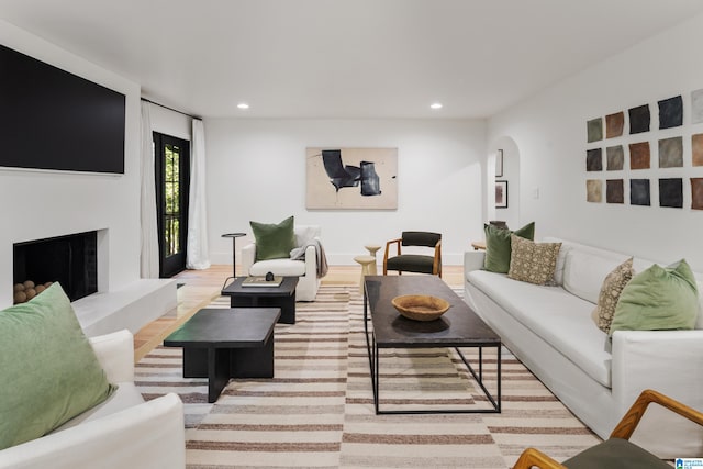 living room with light hardwood / wood-style flooring