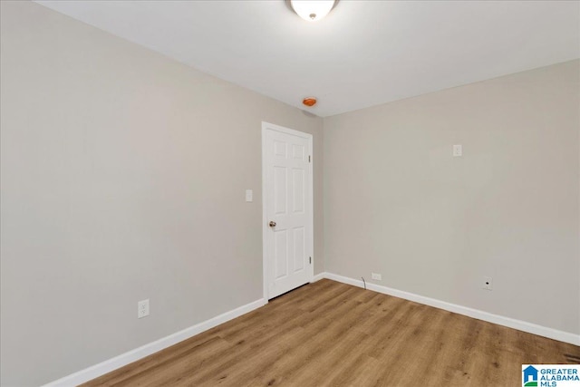 spare room with hardwood / wood-style flooring