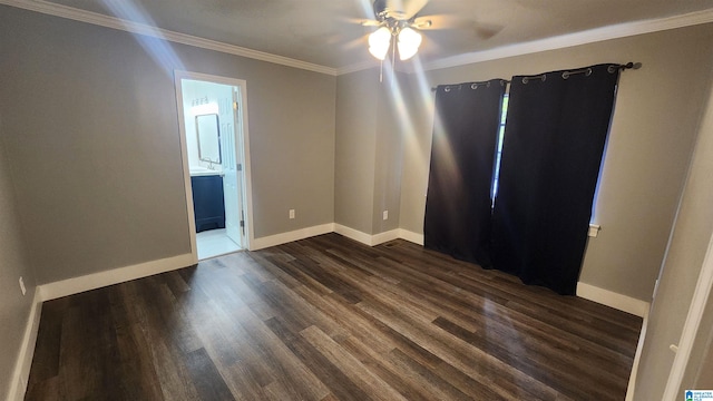 unfurnished room featuring ceiling fan, ornamental molding, and dark wood-type flooring