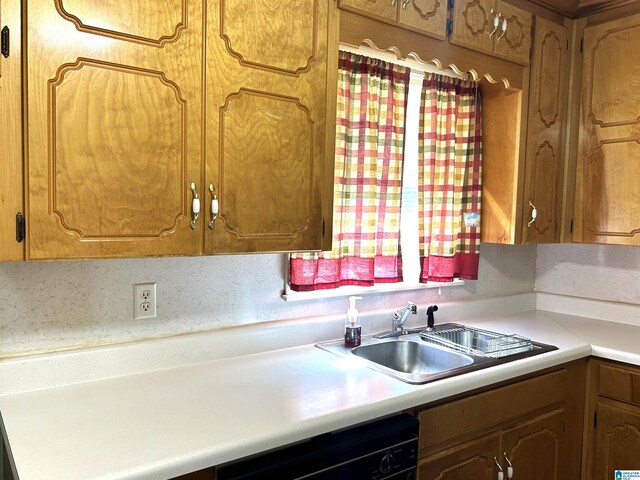 kitchen with backsplash, dishwasher, and sink