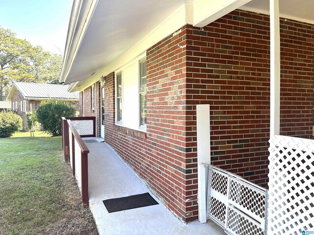 view of side of home featuring a yard