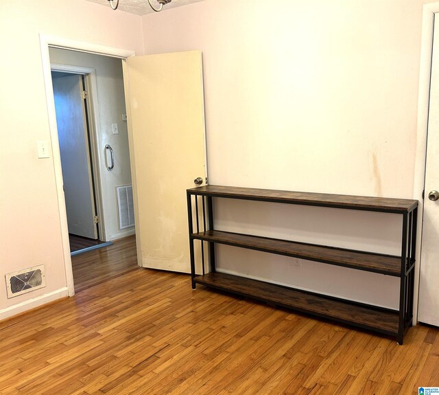 spare room featuring light hardwood / wood-style flooring