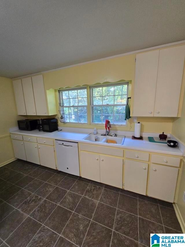 kitchen with dishwasher, sink, and white cabinets