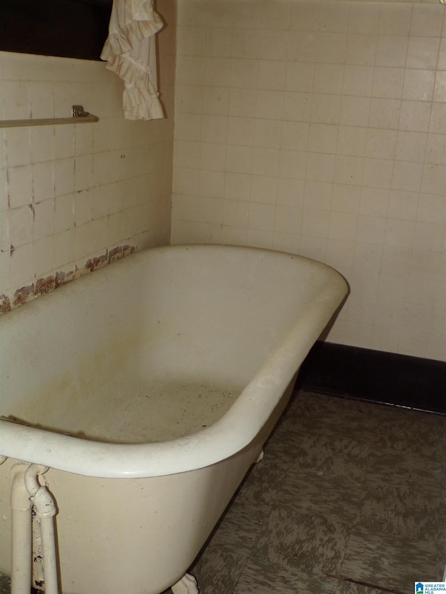 full bathroom with a freestanding bath