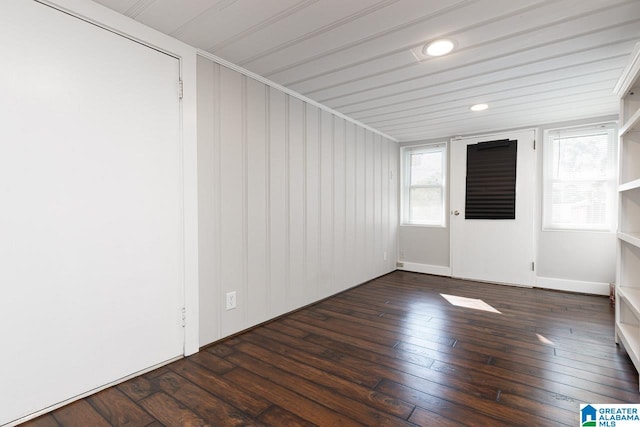 spare room featuring dark hardwood / wood-style flooring