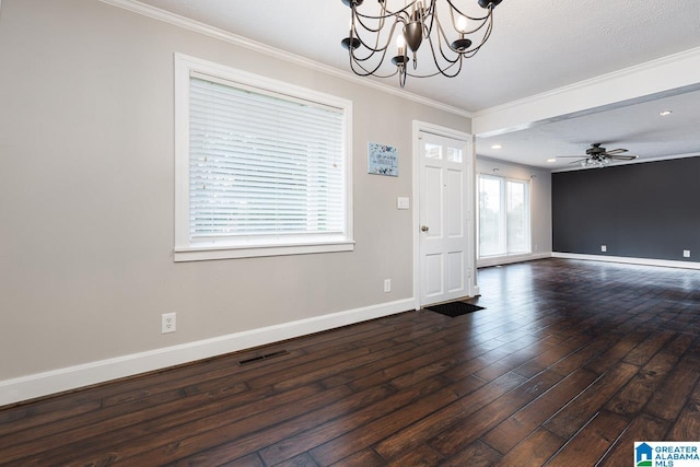 foyer featuring a textured ceiling, ceiling fan with notable chandelier, dark hardwood / wood-style floors, and crown molding