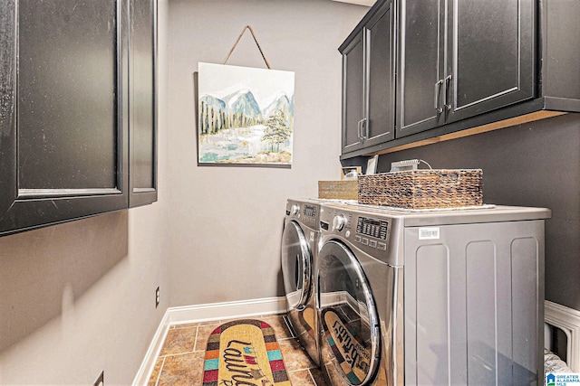 washroom with independent washer and dryer and cabinets