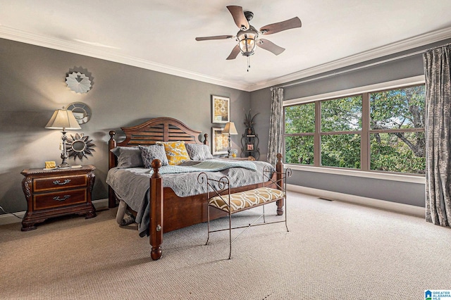 carpeted bedroom with crown molding and ceiling fan