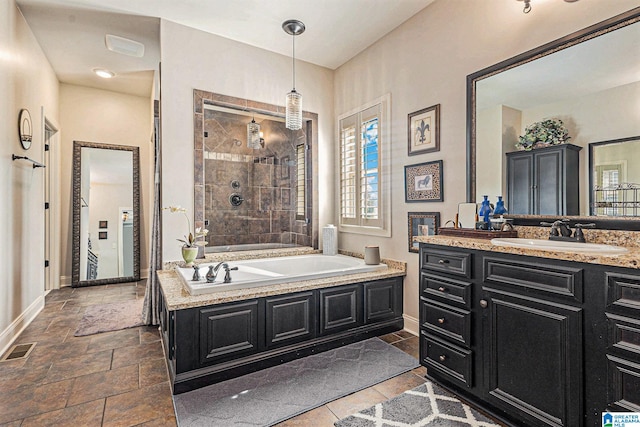 bathroom with independent shower and bath and vanity