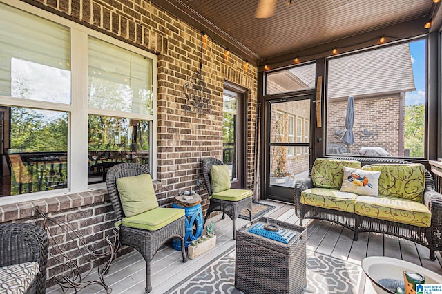 sunroom / solarium featuring wooden ceiling