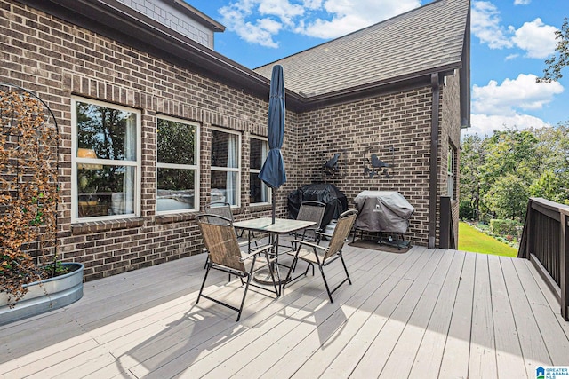 wooden terrace featuring area for grilling