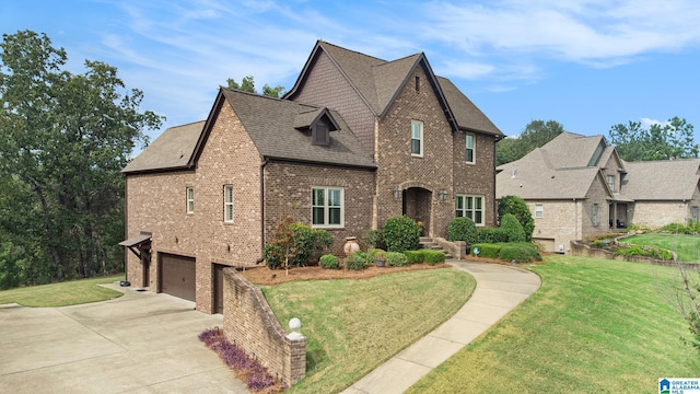 view of front facade with a front yard and a garage