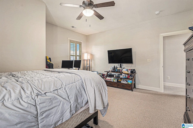 bedroom featuring ceiling fan and light colored carpet