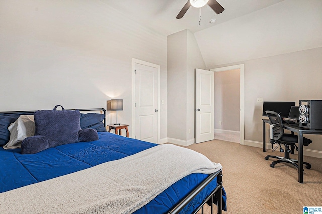 bedroom with ceiling fan, carpet floors, and vaulted ceiling