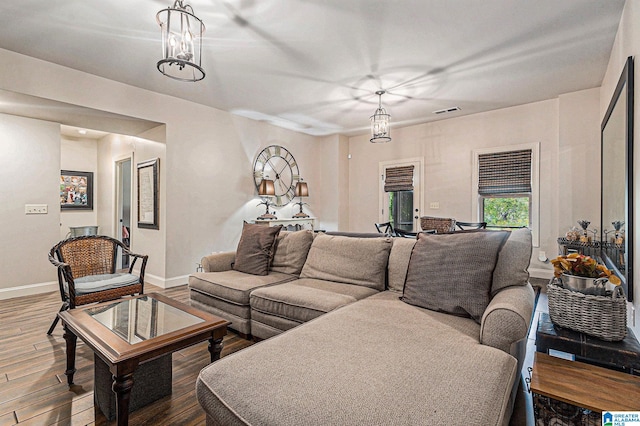 living room with a chandelier and hardwood / wood-style flooring