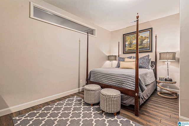 bedroom with hardwood / wood-style floors