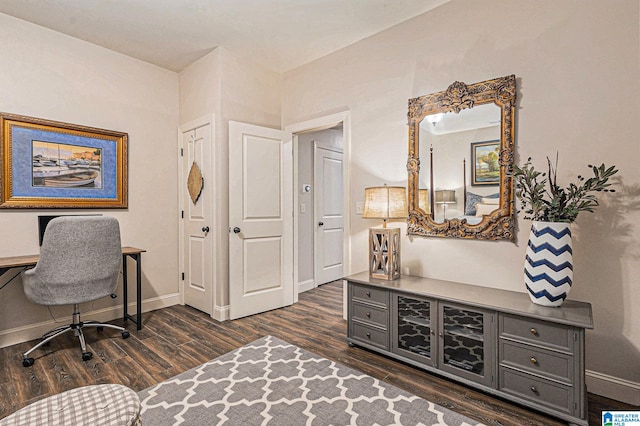 home office with dark wood-type flooring