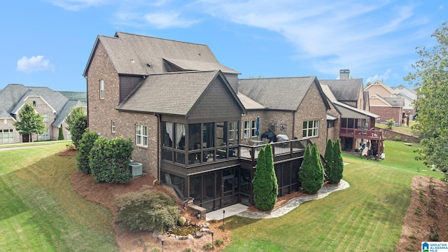 back of house with a wooden deck, cooling unit, and a yard