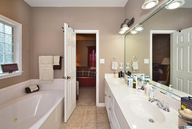 bathroom with vanity, tile patterned floors, and a washtub