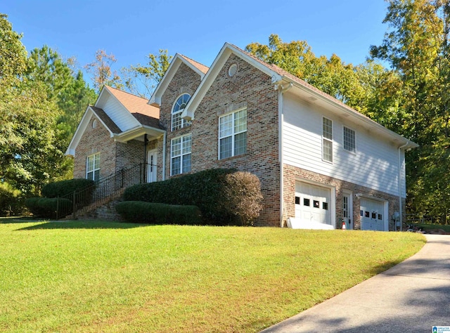 view of property with a front lawn and a garage