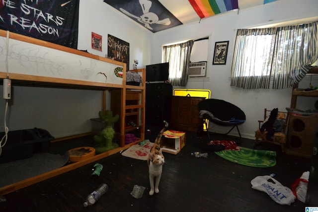 bedroom with hardwood / wood-style floors