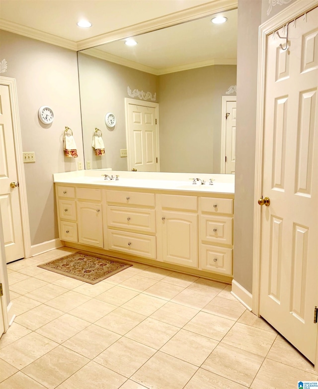 bathroom featuring vanity, crown molding, and tile patterned flooring