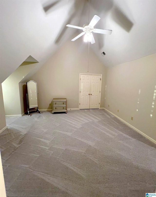 bonus room featuring ceiling fan, vaulted ceiling, and light colored carpet