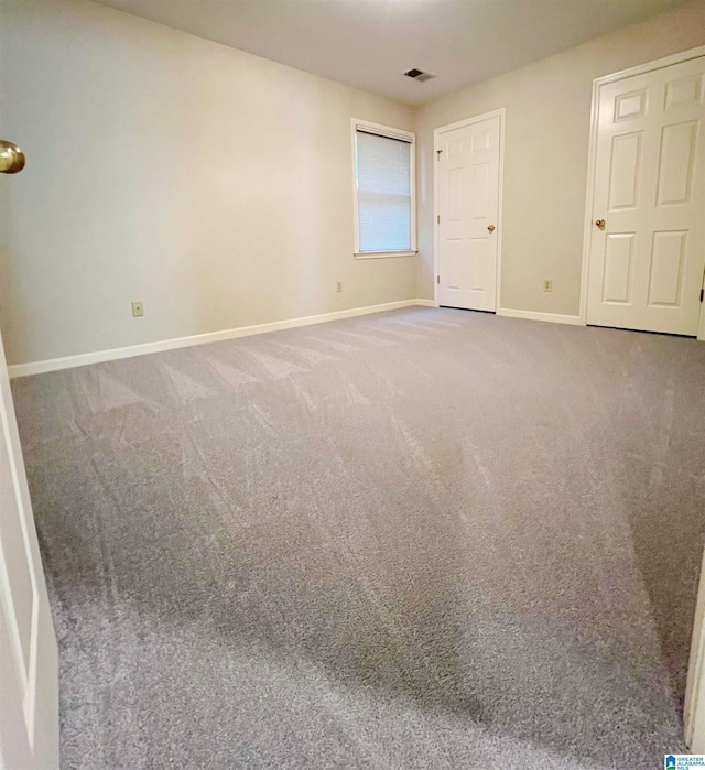 unfurnished bedroom featuring carpet flooring