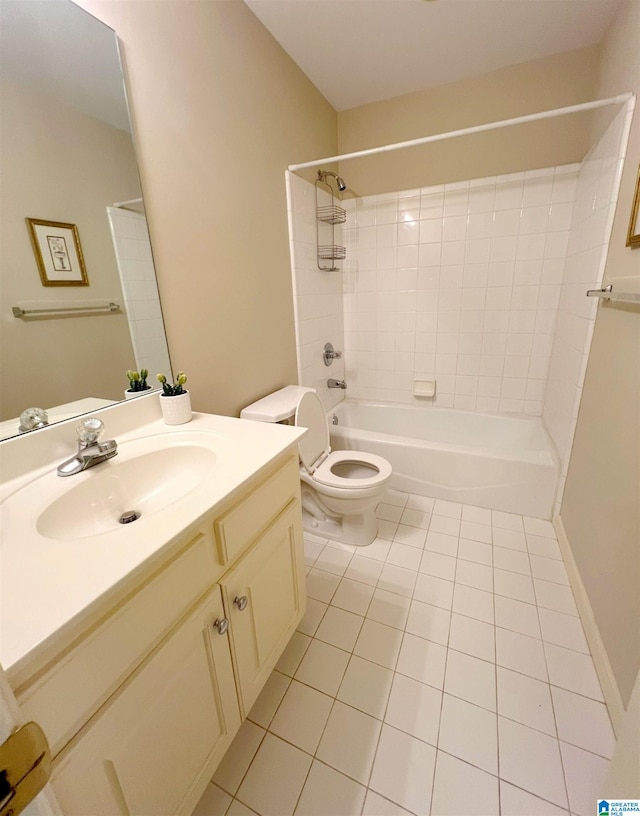 full bathroom with vanity, toilet, tiled shower / bath combo, and tile patterned floors