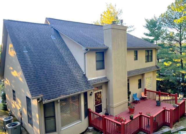 back of property with a wooden deck