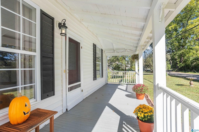 wooden terrace with a porch