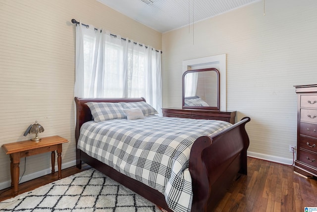 bedroom featuring dark hardwood / wood-style flooring