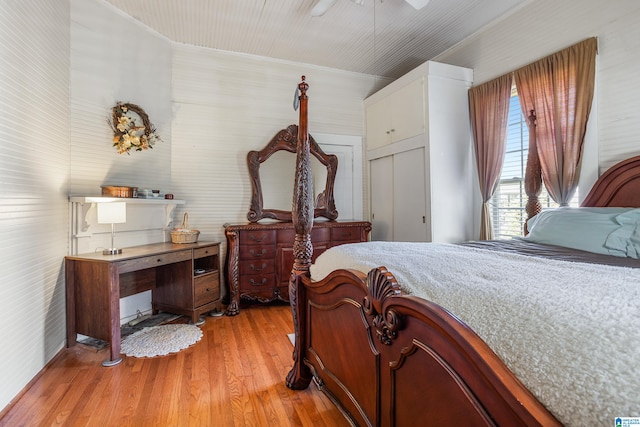 bedroom featuring ceiling fan, a closet, and light hardwood / wood-style floors