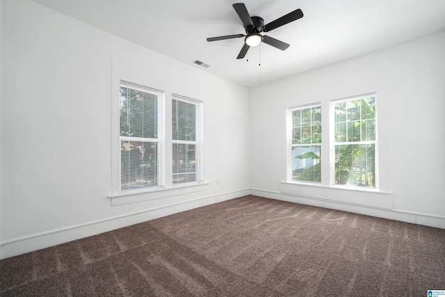 carpeted empty room featuring ceiling fan