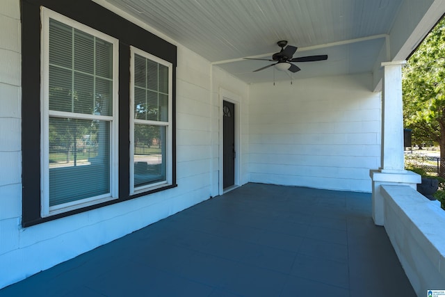 view of patio / terrace with ceiling fan and a porch