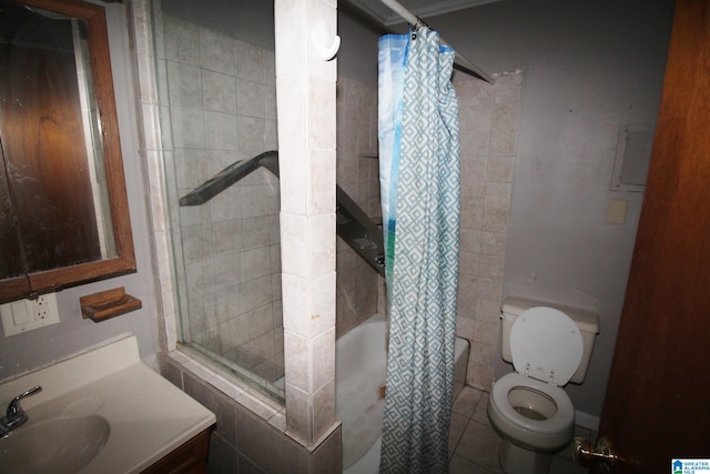 full bathroom with vanity, shower / bath combo with shower curtain, toilet, and tile patterned floors