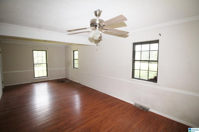 unfurnished room featuring ornamental molding, ceiling fan, and dark hardwood / wood-style flooring